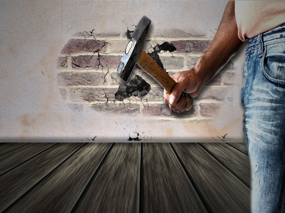 man holding hammer